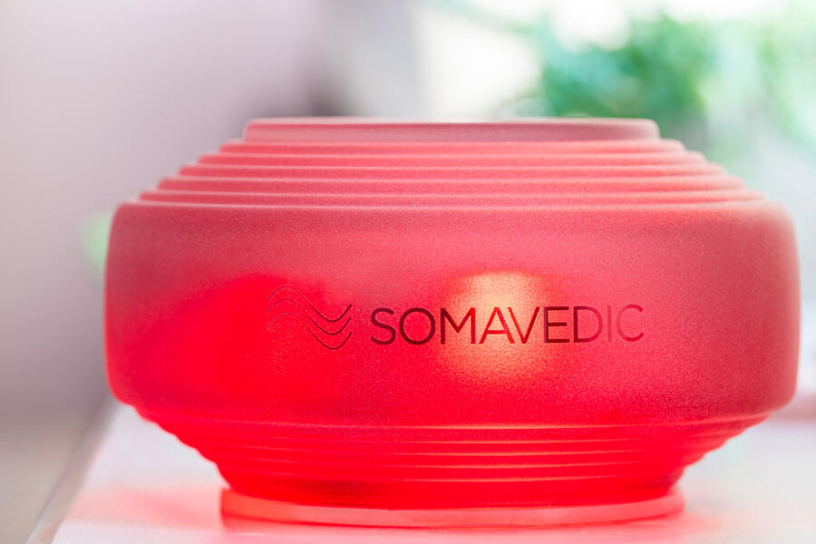 Somavedic device on table